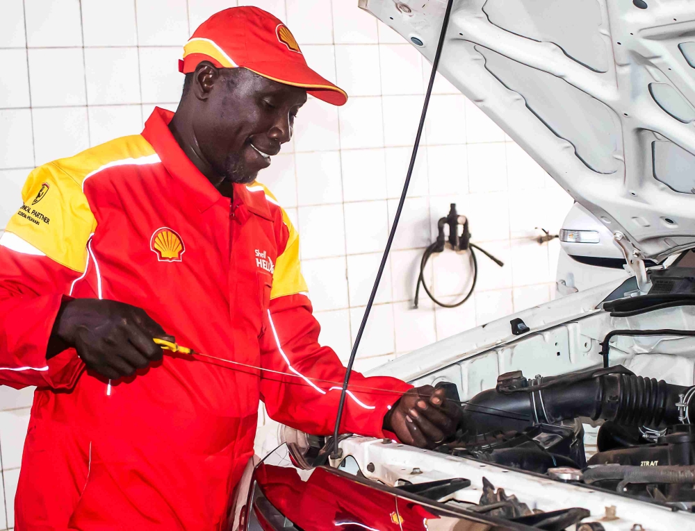 man repairing a car